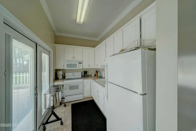 $705,000 | 7009 North Lagoon Drive, Unit 107, Panama City, FL 32408