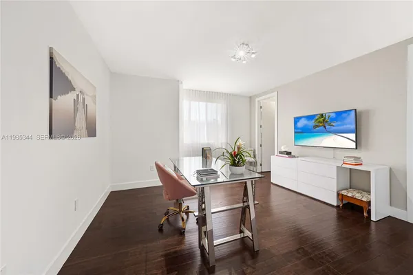 a bathroom with a toilet sink and shower
