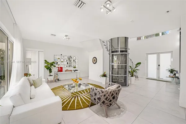 a living room with furniture and a large window