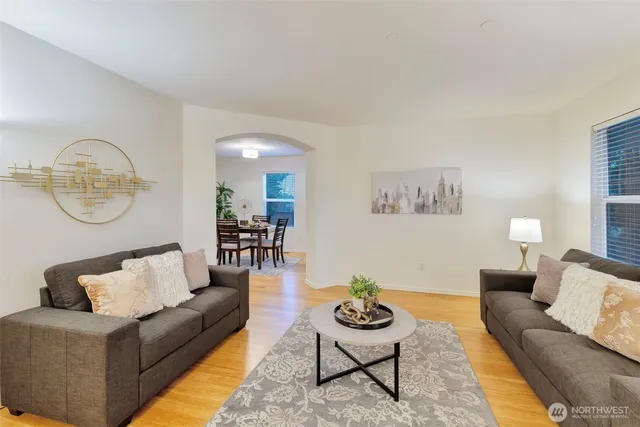 a living room with furniture and a table