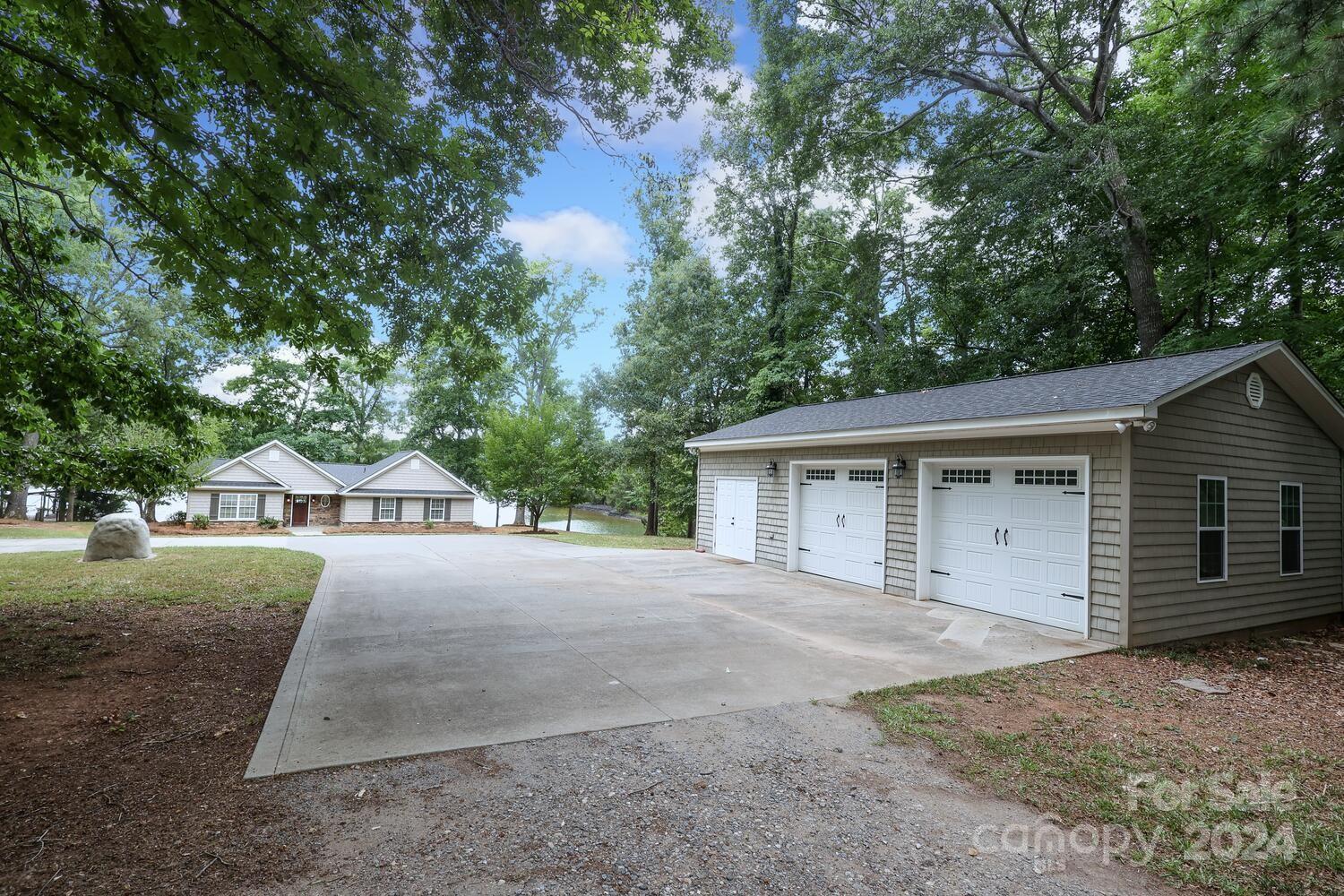 4445 River Oaks Road Clover, SC 29710 - Photo 1 of 35 a view of a house with a yard and large tree