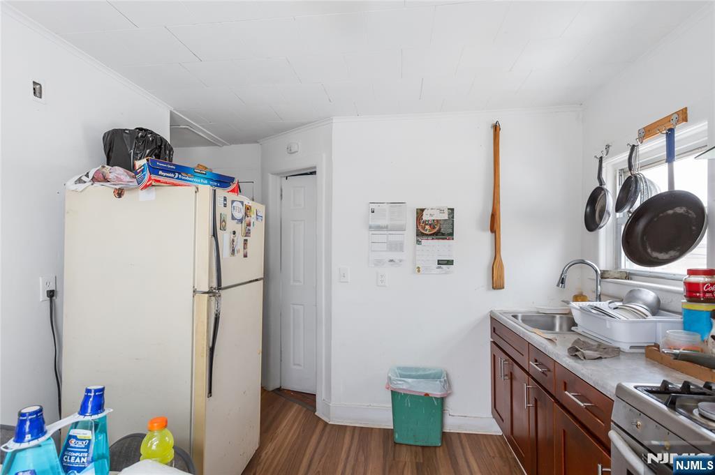 120-122 Lodi Street Hackensack, NJ 07601 - Photo 15 of 50 a kitchen with a refrigerator and a stove