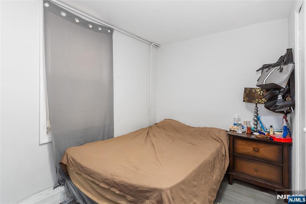 120-122 Lodi Street Hackensack, NJ 07601 - Photo 20 of 50 a bedroom with a bed and a dresser