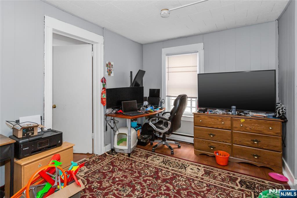 120-122 Lodi Street Hackensack, NJ 07601 - Photo 23 of 50 a room with furniture and flat screen tv