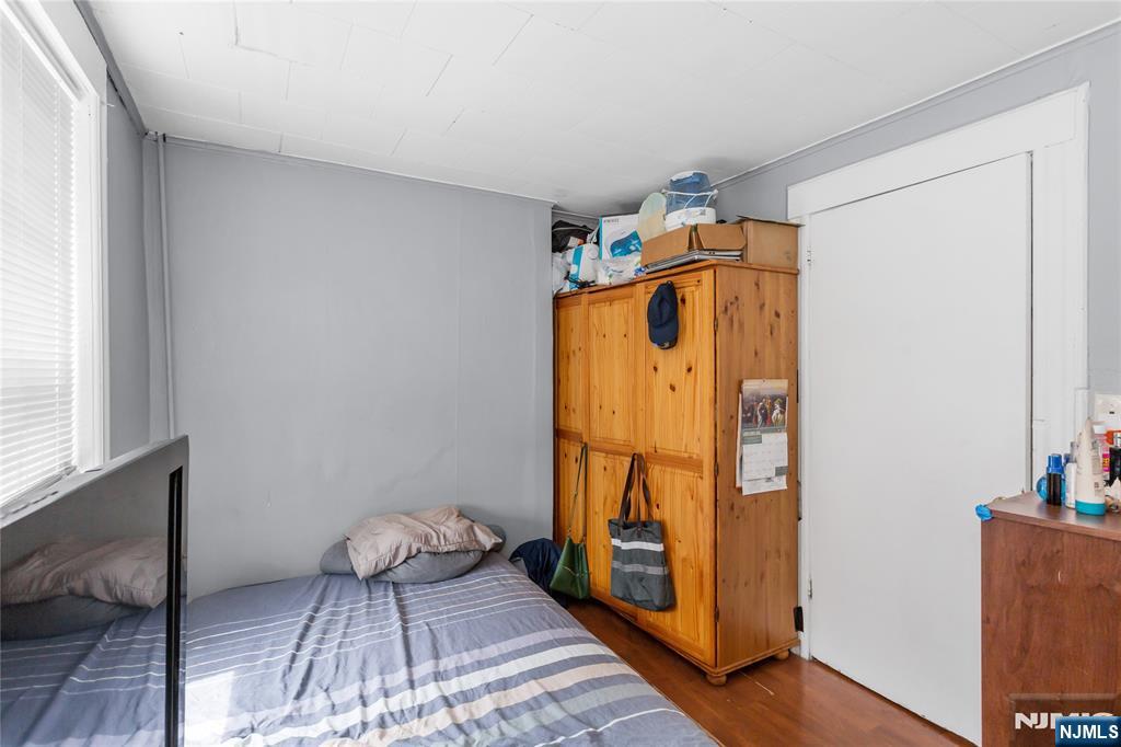 120-122 Lodi Street Hackensack, NJ 07601 - Photo 27 of 50 a bedroom with a bed and wooden floor