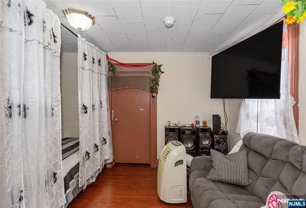 120-122 Lodi Street Hackensack, NJ 07601 - Photo 28 of 50 a living room with furniture and a flat screen tv