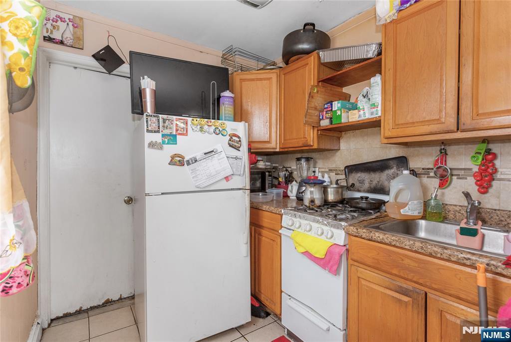120-122 Lodi Street Hackensack, NJ 07601 - Photo 3 of 50 a white refrigerator freezer sitting inside of a kitchen