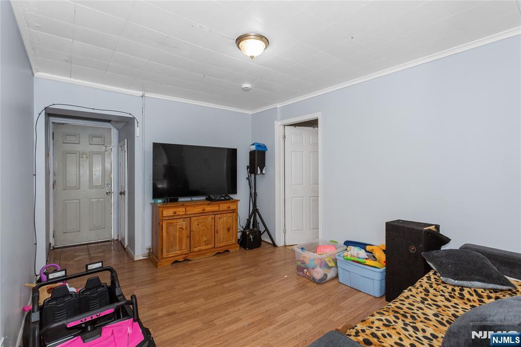 120-122 Lodi Street Hackensack, NJ 07601 - Photo 31 of 50 a living room with furniture and a flat screen tv