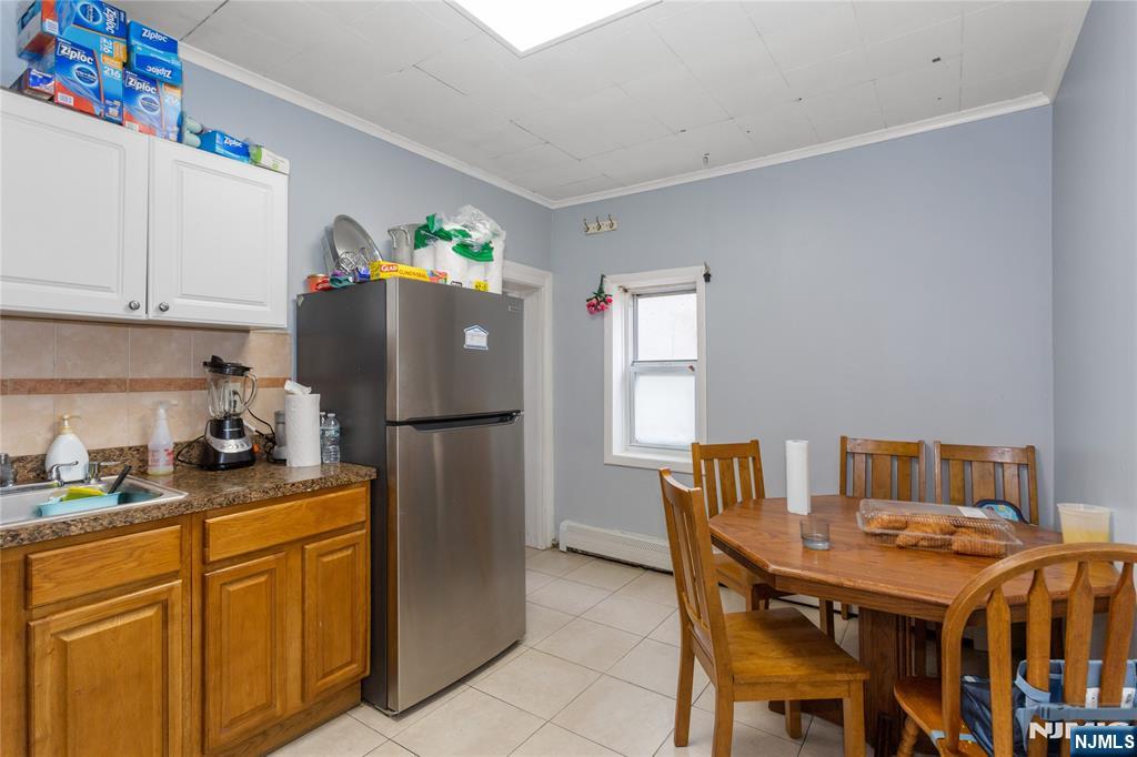 120-122 Lodi Street Hackensack, NJ 07601 - Photo 32 of 50 a kitchen with a refrigerator and a stove top oven