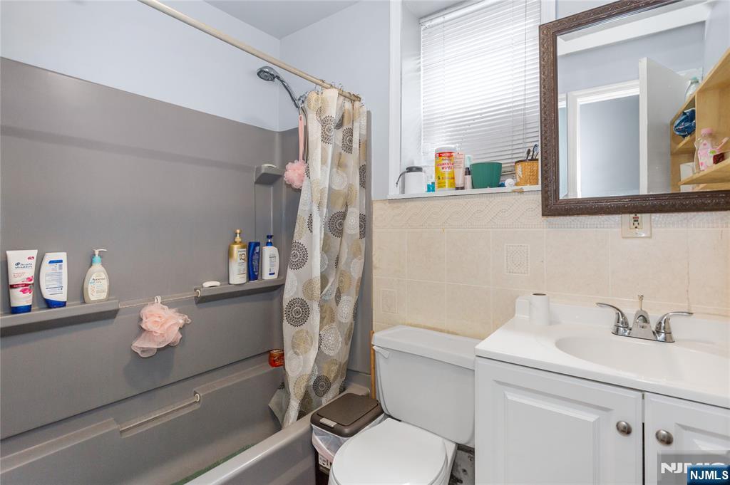 120-122 Lodi Street Hackensack, NJ 07601 - Photo 35 of 50 a bathroom with a sink toilet and shower