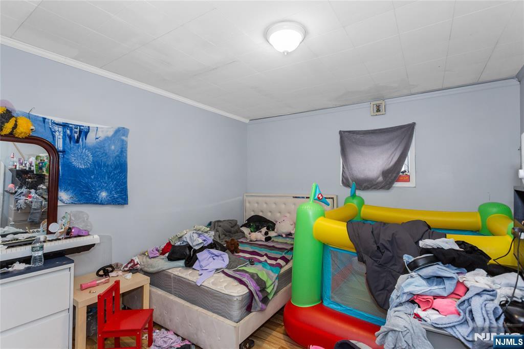 120-122 Lodi Street Hackensack, NJ 07601 - Photo 36 of 50 a kids room with toys and dresser