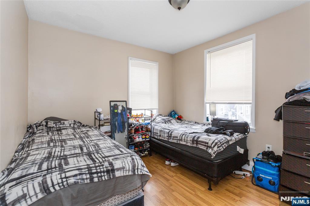 120-122 Lodi Street Hackensack, NJ 07601 - Photo 38 of 50 a bedroom with two beds and a window