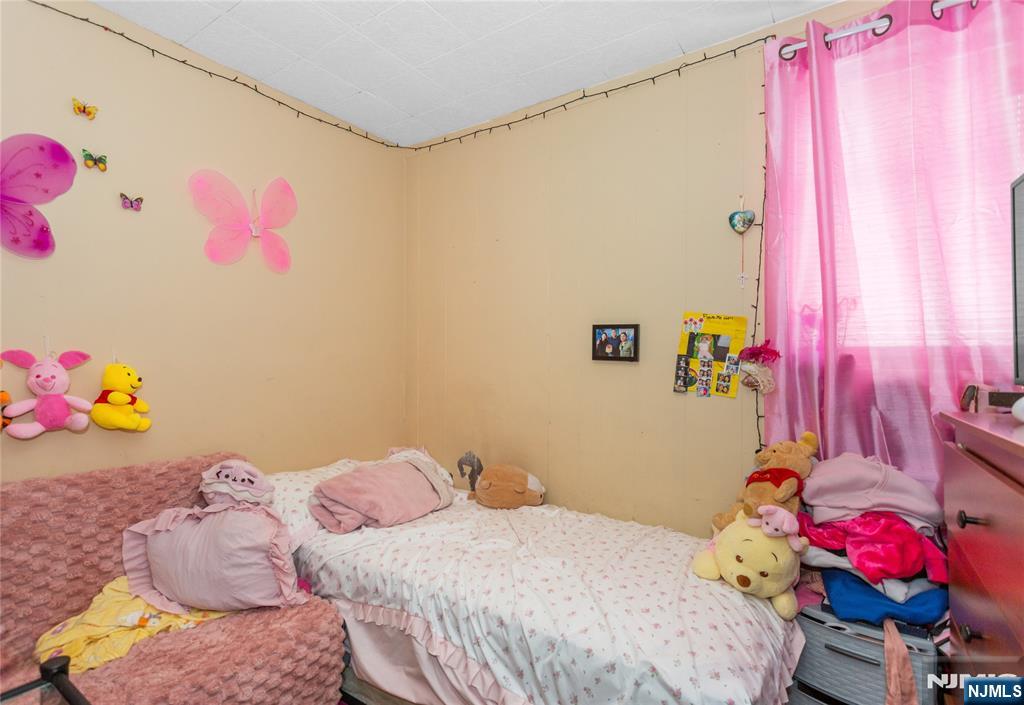 120-122 Lodi Street Hackensack, NJ 07601 - Photo 4 of 50 a bedroom with a bed and a couch