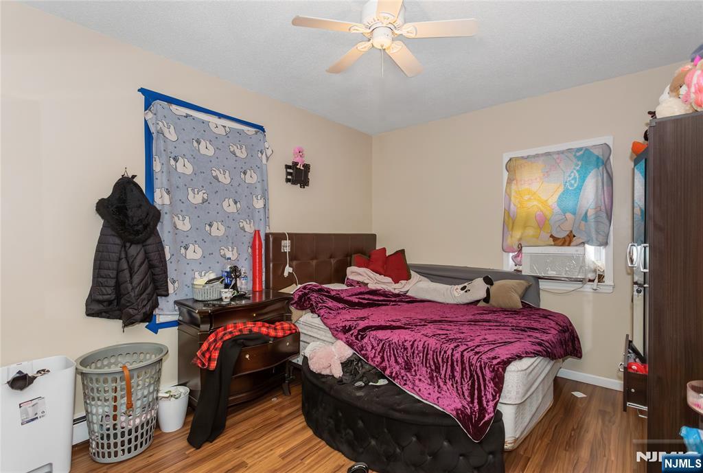120-122 Lodi Street Hackensack, NJ 07601 - Photo 41 of 50 a bedroom with a bed and wooden floor