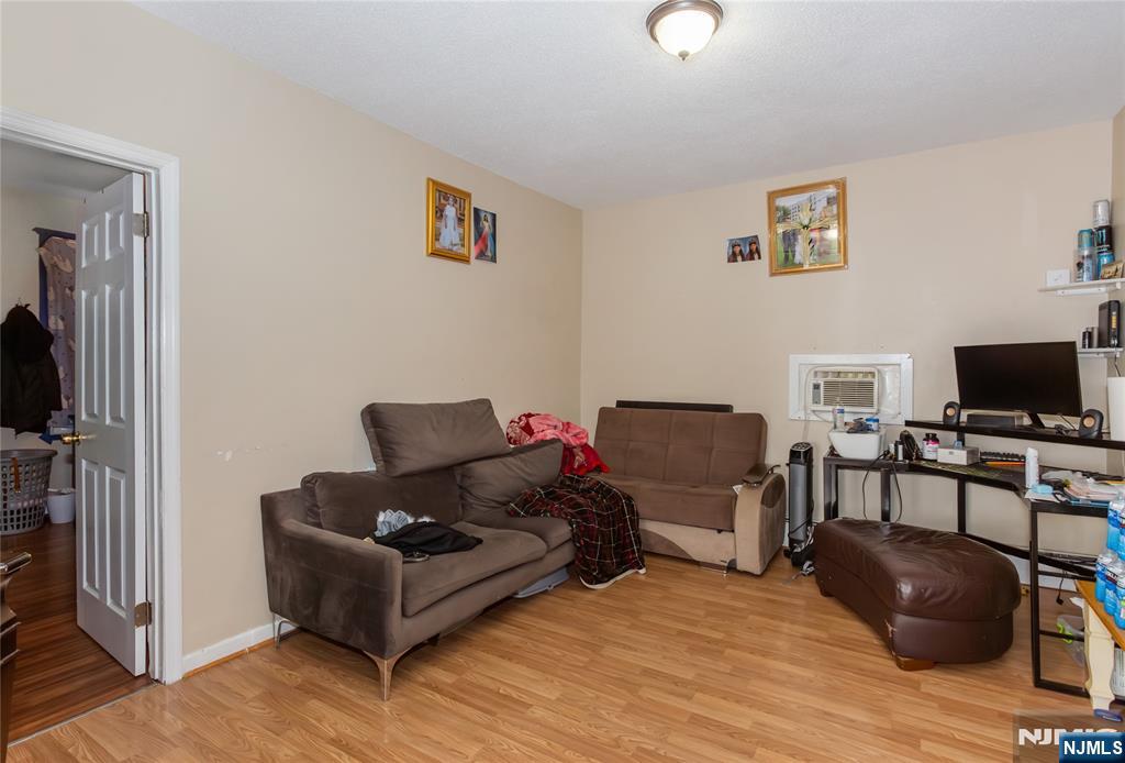 120-122 Lodi Street Hackensack, NJ 07601 - Photo 43 of 50 a living room with furniture and a flat screen tv