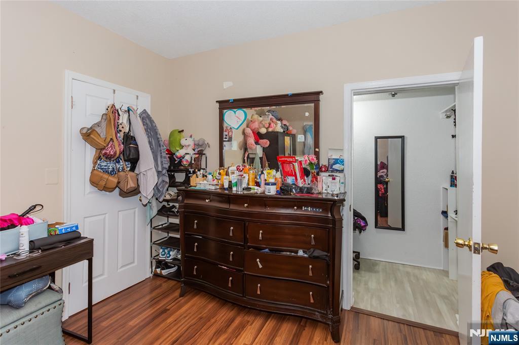 120-122 Lodi Street Hackensack, NJ 07601 - Photo 44 of 50 a bed room with furniture and a mirror