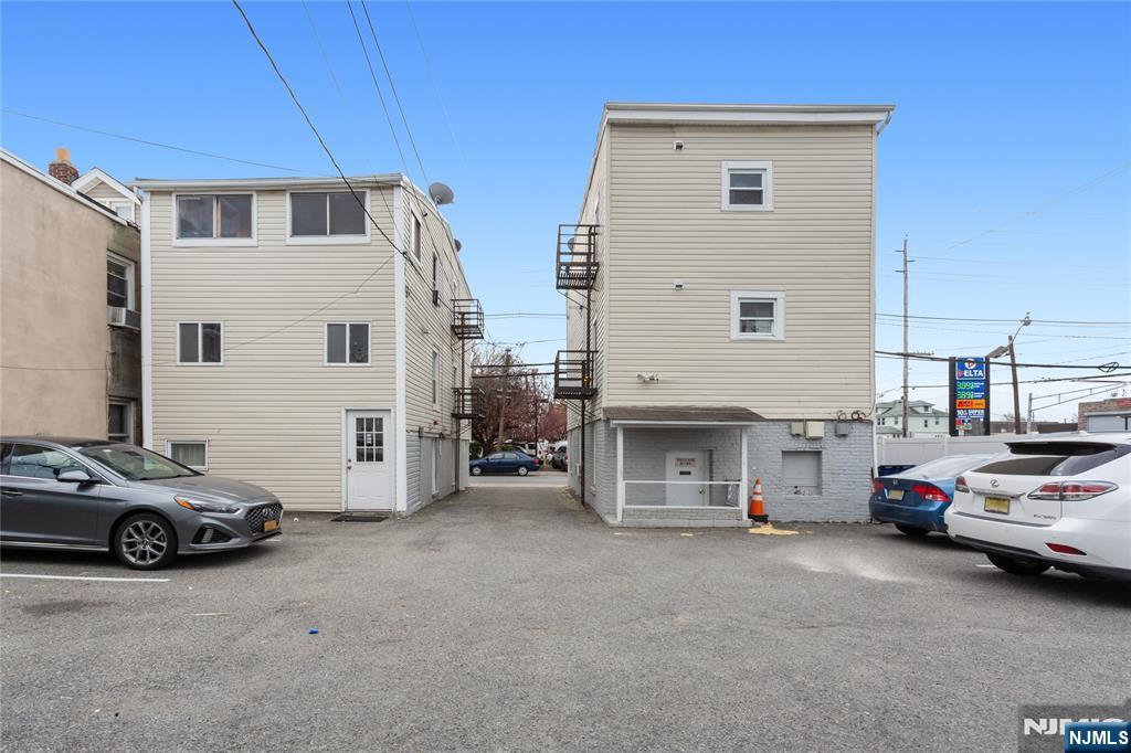 120-122 Lodi Street Hackensack, NJ 07601 - Photo 45 of 50 a view of a cars park in front of a house