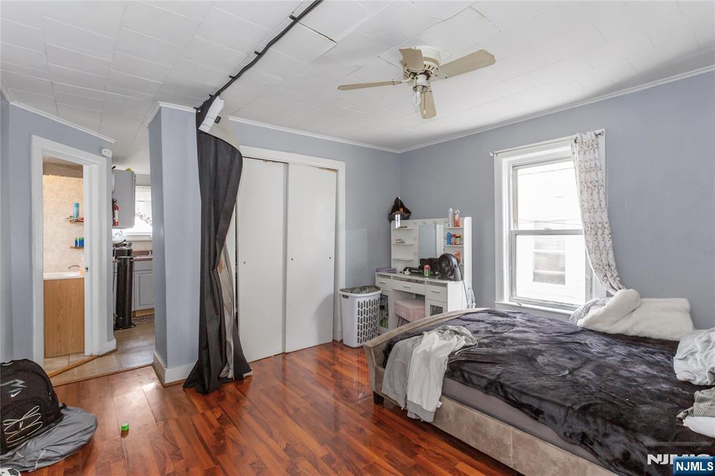 120-122 Lodi Street Hackensack, NJ 07601 - Photo 7 of 50 a bedroom with a bed and a window