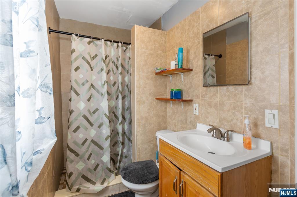 120-122 Lodi Street Hackensack, NJ 07601 - Photo 10 of 50 a bathroom with a sink toilet and shower