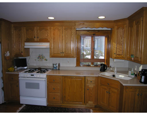 72 Walnut Street Needham, MA 02492 - Photo 11 of 16 a kitchen with a sink stove and cabinets