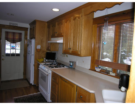 72 Walnut Street Needham, MA 02492 - Photo 13 of 16 a kitchen that has a sink and a stove