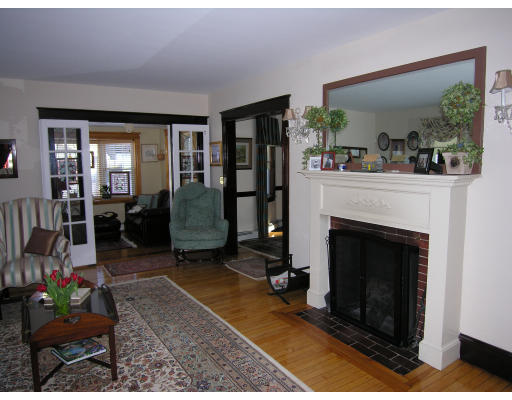 72 Walnut Street Needham, MA 02492 - Photo 5 of 16 a living room with furniture and a fireplace