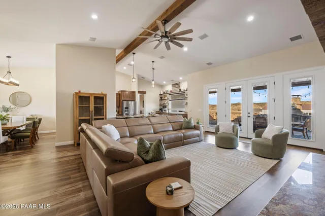 a en suite bathroom with a granite countertop sink and a mirror