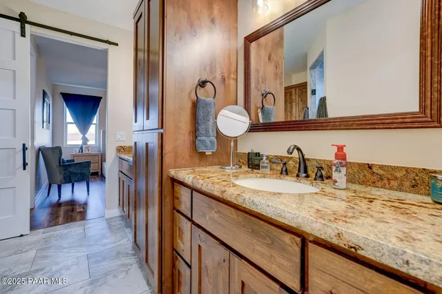 a view of a livingroom with furniture and a rug