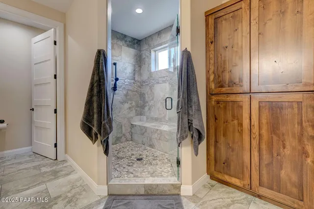 a view of room with window and ceiling fan