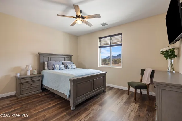 a view of roof deck with couch and chairs