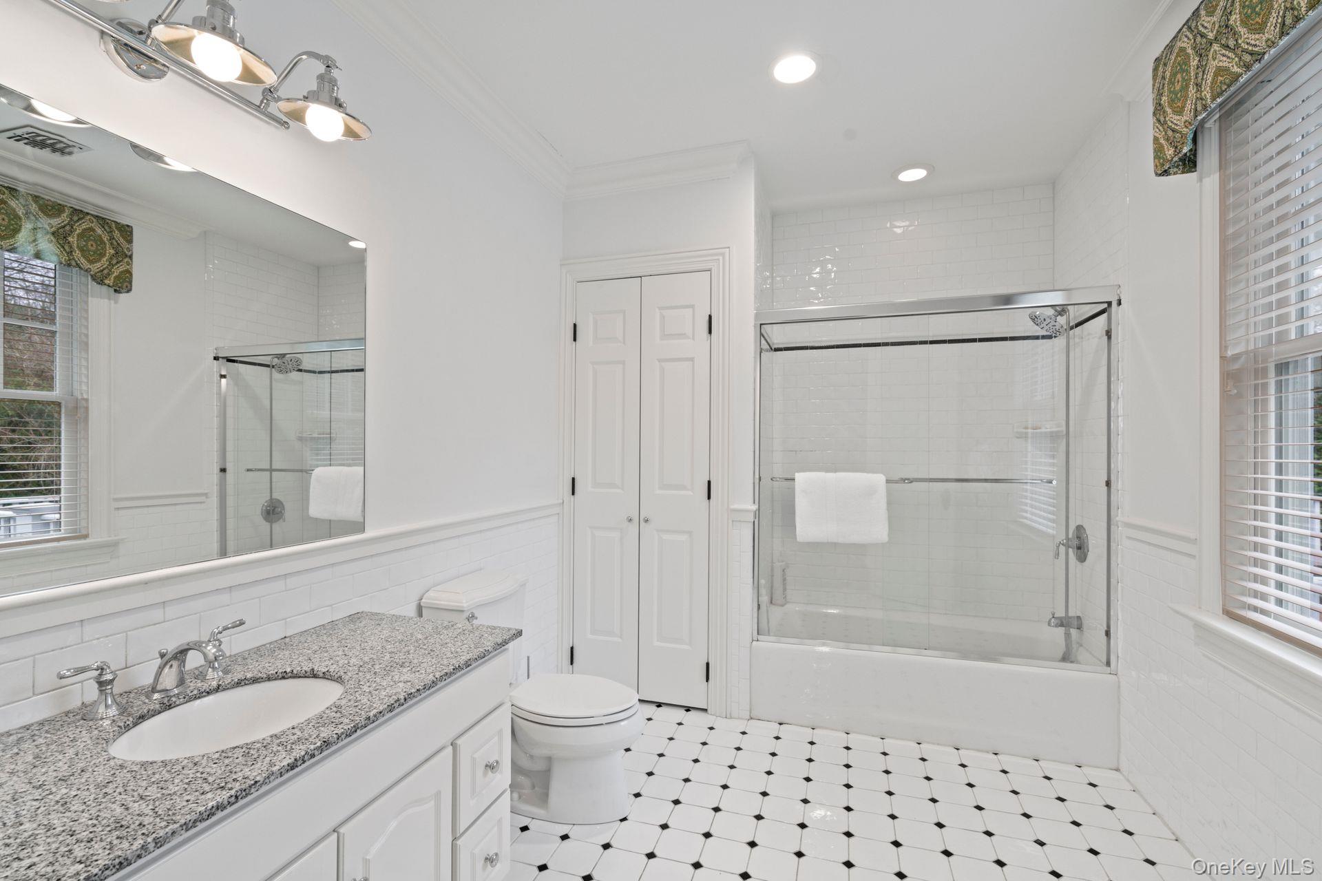 280 Southdown Road Lloyd Harbor, NY 11743 - Photo 22 of 39 a bathroom with a granite countertop sink toilet and shower