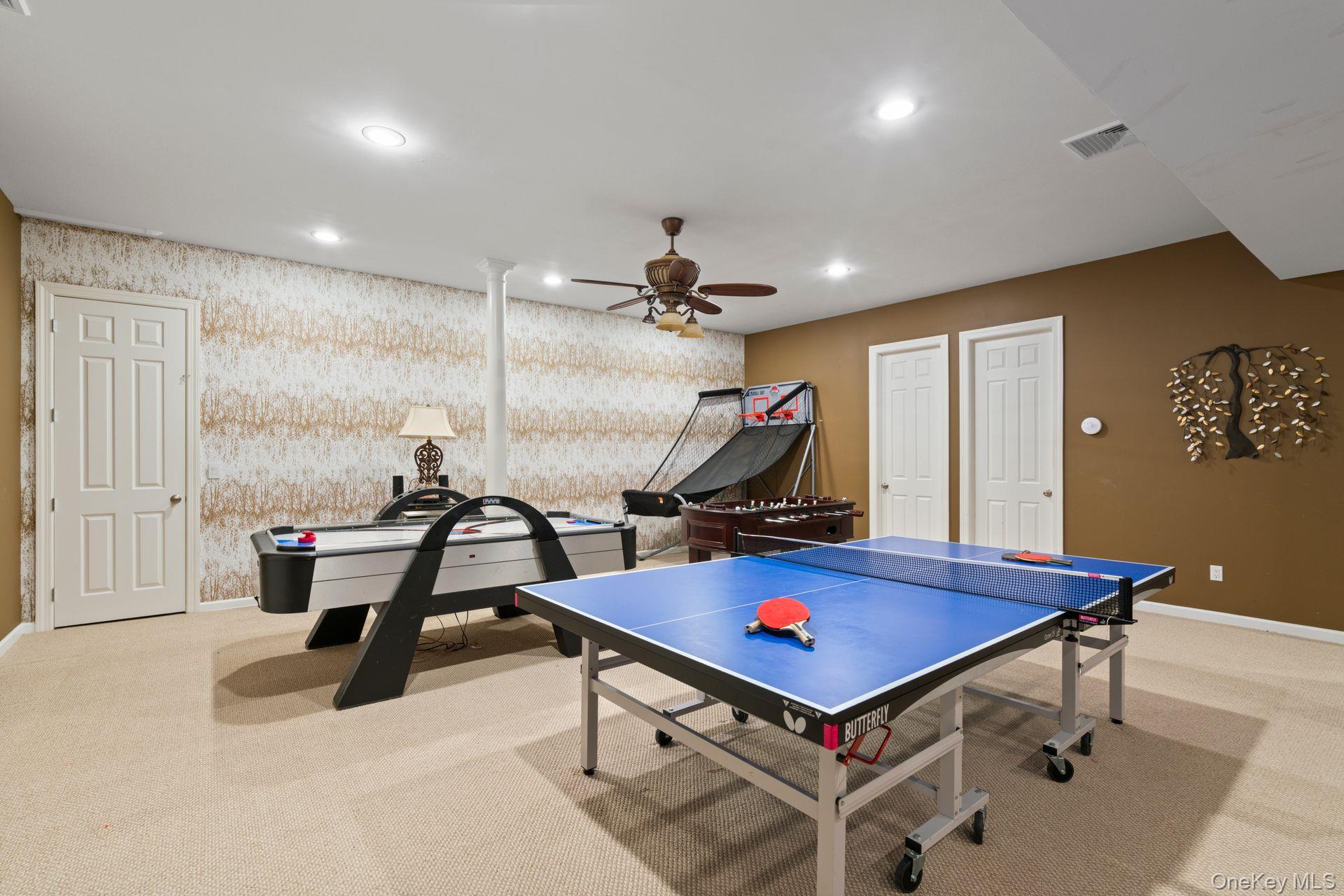 280 Southdown Road Lloyd Harbor, NY 11743 - Photo 27 of 39 a room with furniture pool table and a chandelier