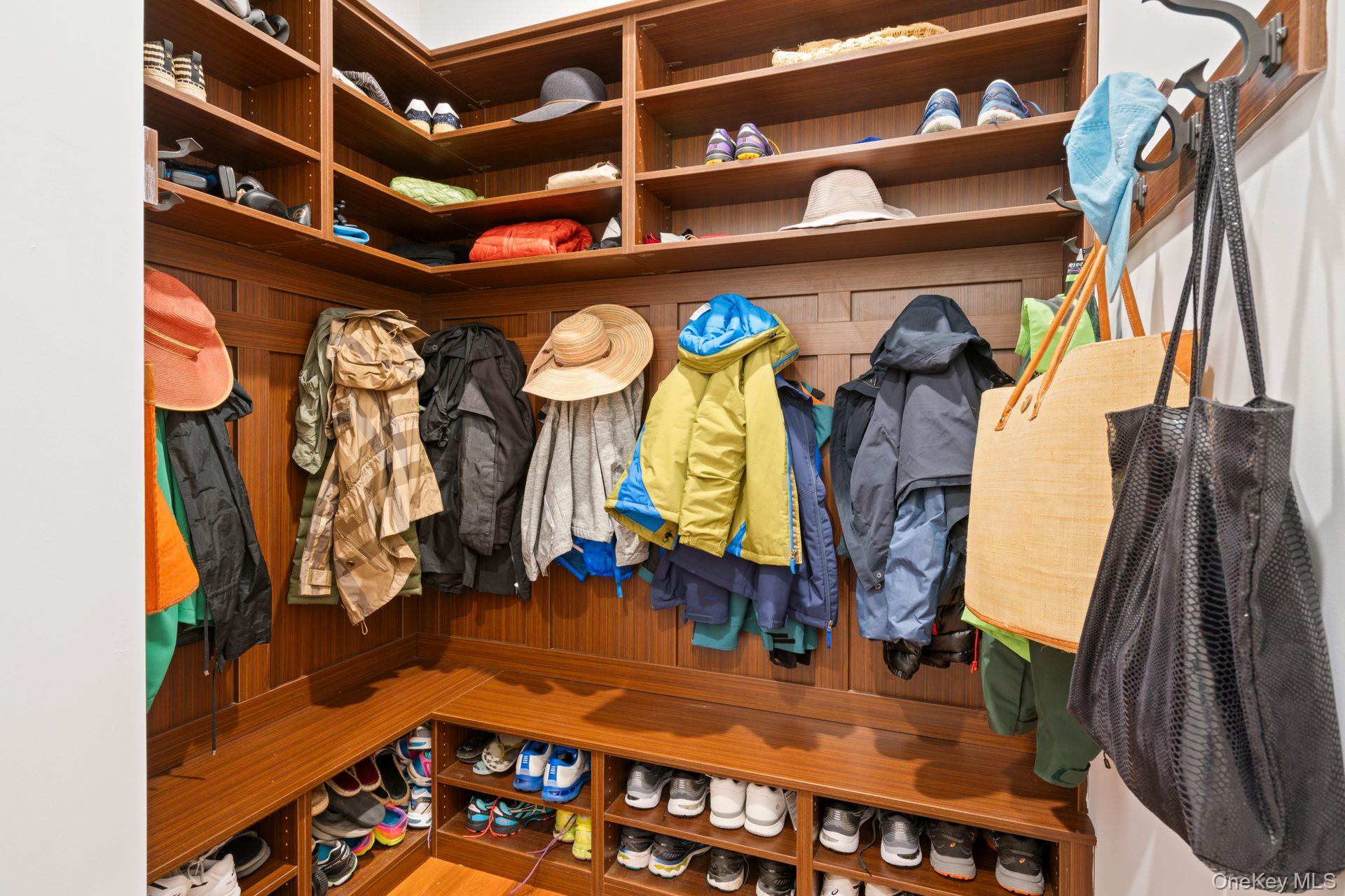 280 Southdown Road Lloyd Harbor, NY 11743 - Photo 30 of 39 a view of walk in closet with clothes and shoes