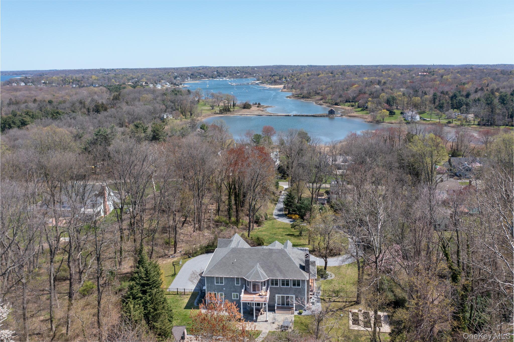 280 Southdown Road Lloyd Harbor, NY 11743 - Photo 32 of 39 an aerial view of a house with a lake view