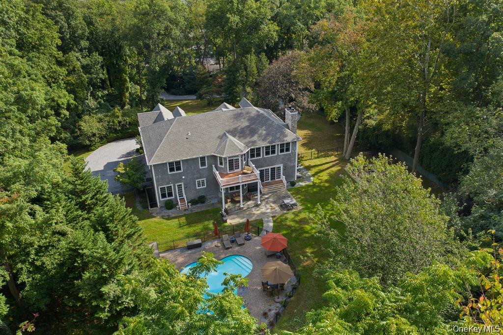 280 Southdown Road Lloyd Harbor, NY 11743 - Photo 35 of 39 an aerial view of a house with a big yard and large trees