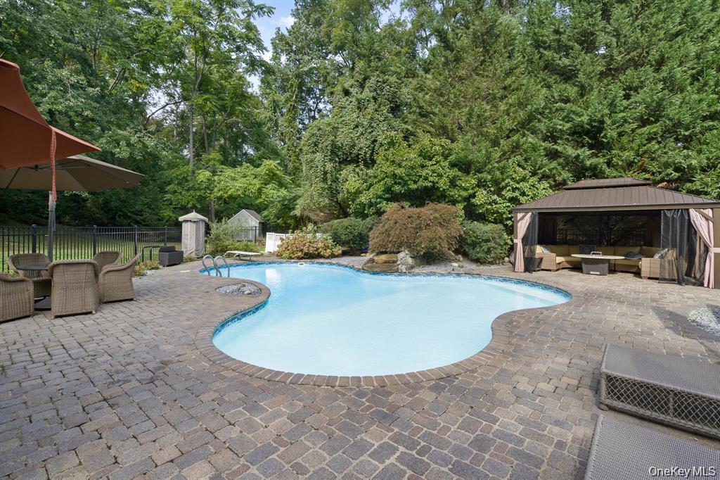 280 Southdown Road Lloyd Harbor, NY 11743 - Photo 36 of 39 a view of a house with backyard and sitting area