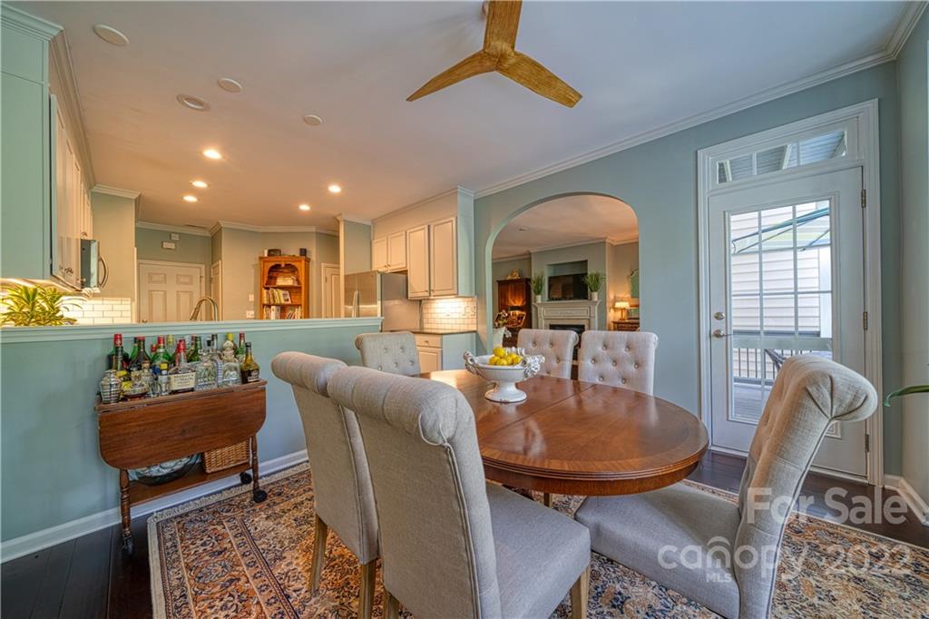 2086 Calloway Pines Drive Tega Cay, SC 29708 - Photo 12 of 47 a living room with furniture a dining table and a fireplace