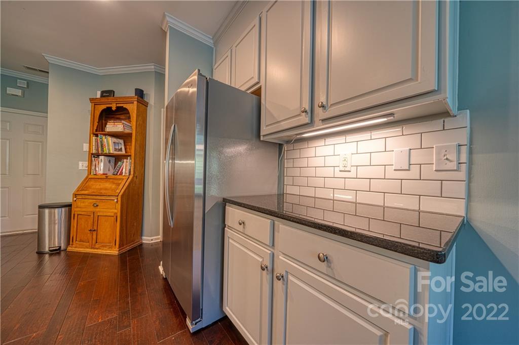 2086 Calloway Pines Drive Tega Cay, SC 29708 - Photo 16 of 47 a kitchen with stainless steel appliances granite countertop a refrigerator and a stove