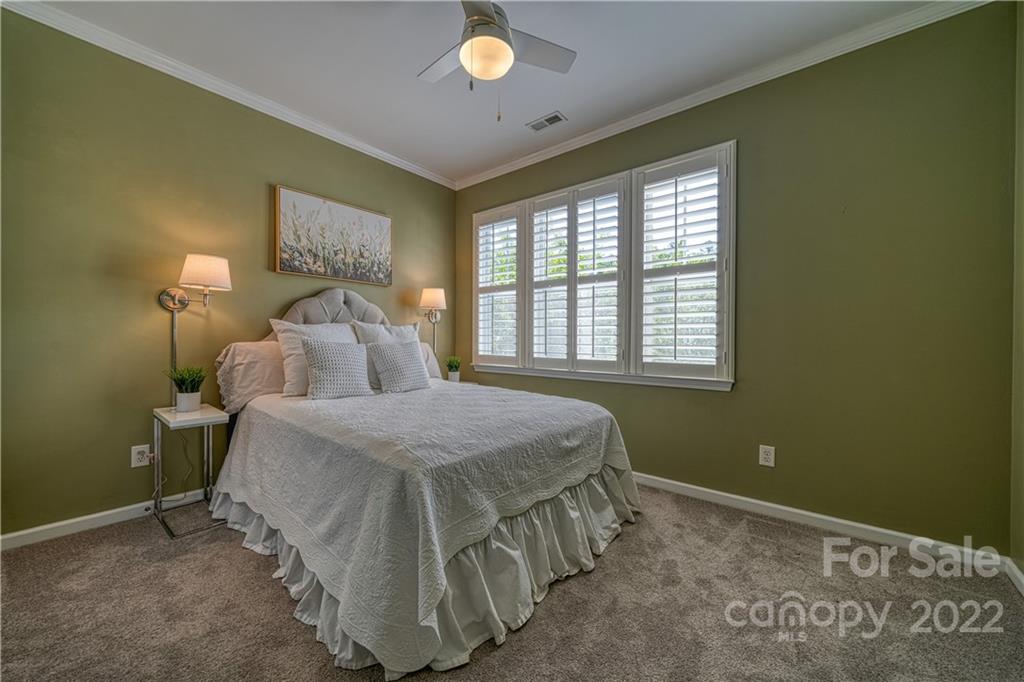 2086 Calloway Pines Drive Tega Cay, SC 29708 - Photo 35 of 47 a bedroom with a bed and a window