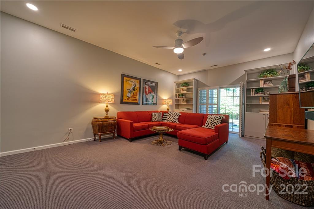 2086 Calloway Pines Drive Tega Cay, SC 29708 - Photo 40 of 47 a bedroom with furniture and a flat screen tv