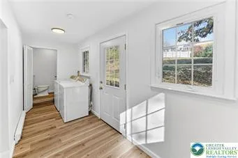 a view of kitchen with furniture and wooden floor