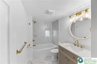 a bathroom with a sink a toilet and a bathtub