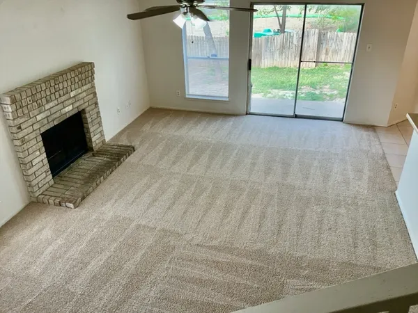 a view of an empty room with windows