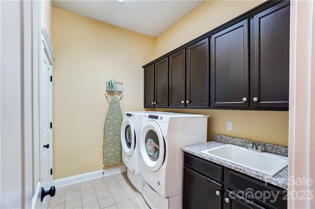 816 Elswick Court Fort Mill, SC 29708 - Photo 23 of 46 a utility room with dryer and washer