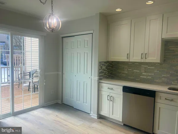 a view of a kitchen with electric appliances