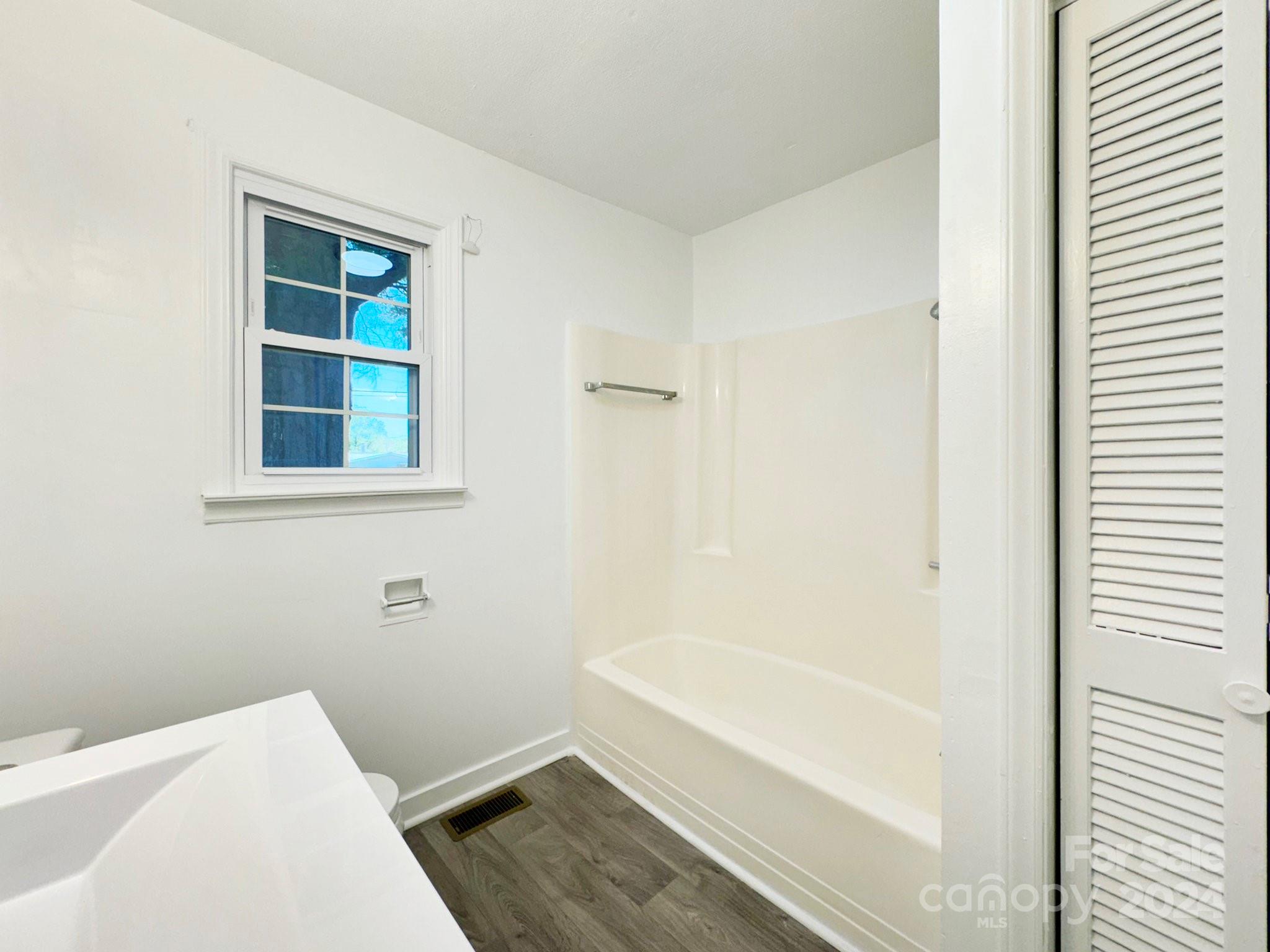 875 Marys Grove Road Cherryville, NC 28021 - Photo 16 of 28 a bathroom with bathtub and window