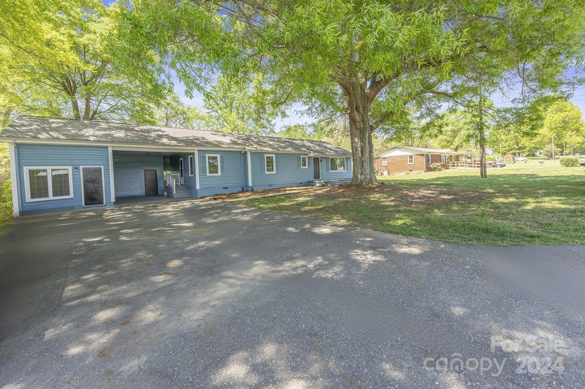 875 Marys Grove Road Cherryville, NC 28021 - Photo 2 of 28 a view of a house with a tree in front of it