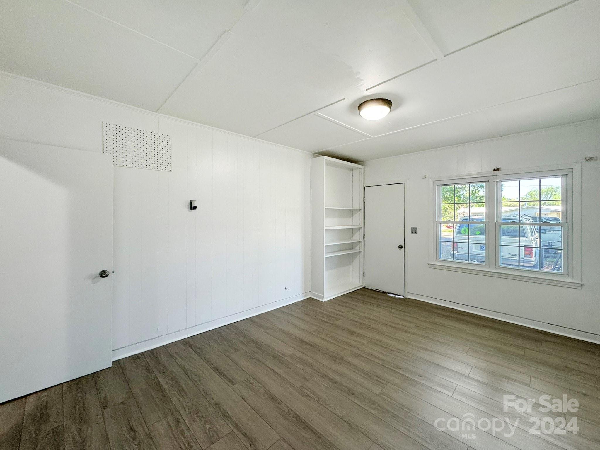 875 Marys Grove Road Cherryville, NC 28021 - Photo 25 of 28 wooden floor in an empty room with a window