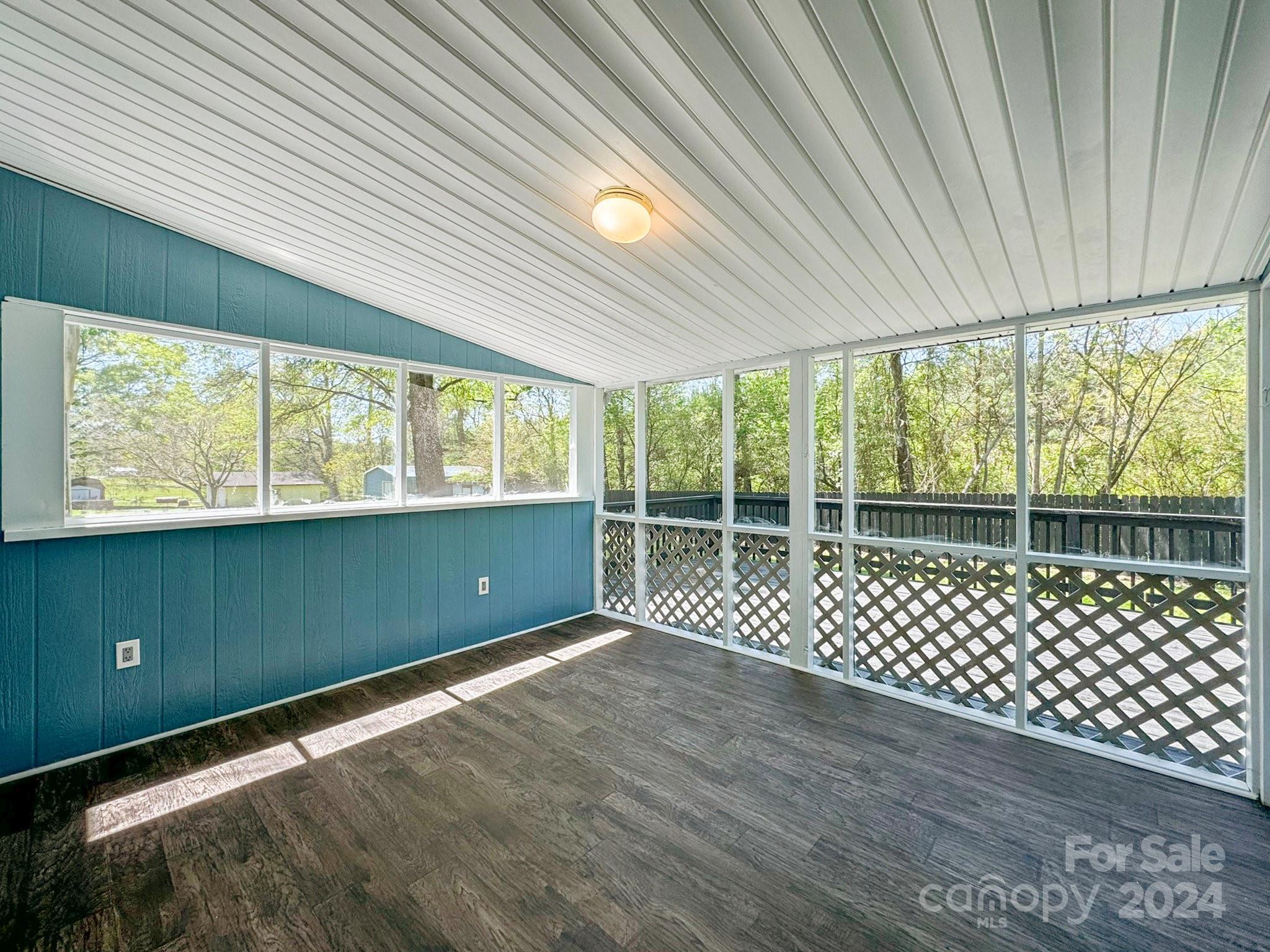 875 Marys Grove Road Cherryville, NC 28021 - Photo 3 of 28 a view of a room with wooden floor and windows