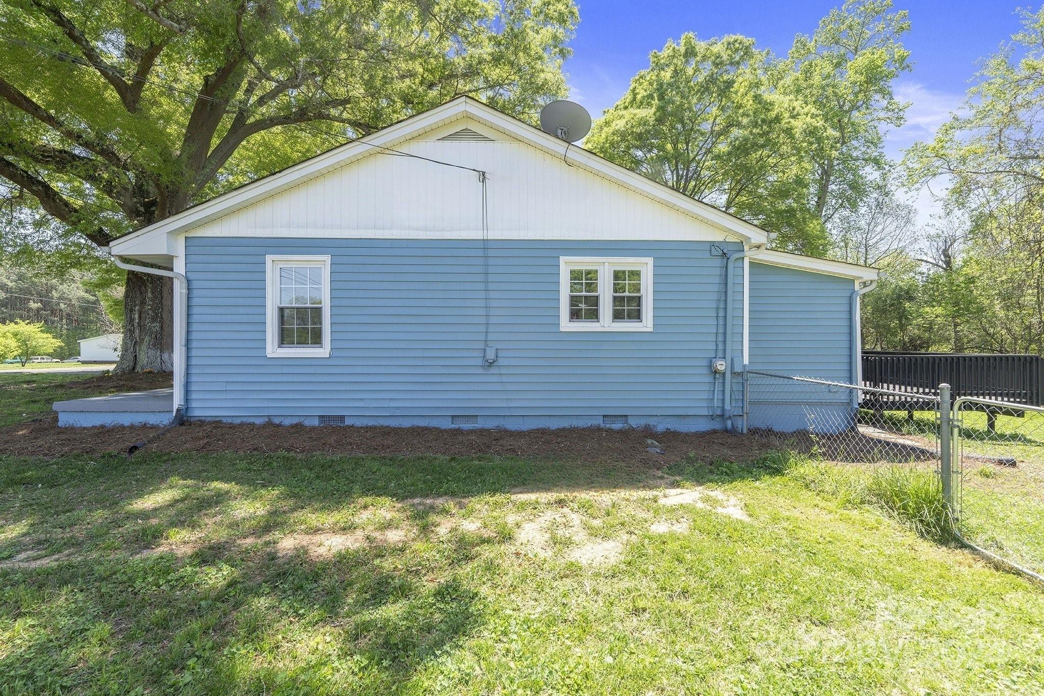 875 Marys Grove Road Cherryville, NC 28021 - Photo 6 of 28 a view of a backyard with a large tree